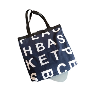 Navy blue large canvas tote bag with white letter print and durable shoulder straps
