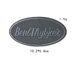 Oval grey camouflage embroidered patch with Bent Thykjær lettering for DIY apparel