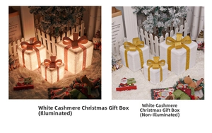 Three white plush Christmas gift boxes with LED lights and gold bows in detail view