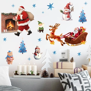 Detailed view of Christmas wall stickers featuring Santa Claus and reindeer on a white wall
