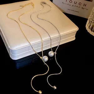 Minimalist gold and silver Y-shaped necklaces with sliding pearl and metallic bead ends