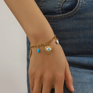 Gold Hamsa and Evil Eye charm bracelet for women with heart pendant and blue beads