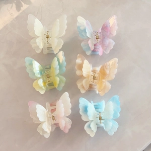 Set of six 3D butterfly hair claws in various marble and translucent colors