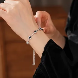 Elegant adjustable silver bracelet with five oval black zircons and pavé diamonds