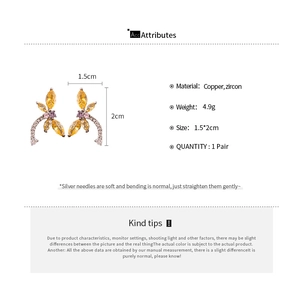 Detailed product specifications for dragonfly earrings featuring copper and zircon materials