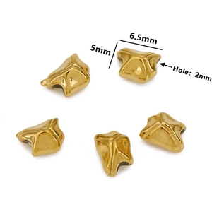 Macro detail of irregular gold-plated stainless steel beads with 2mm hole for DIY jewelry