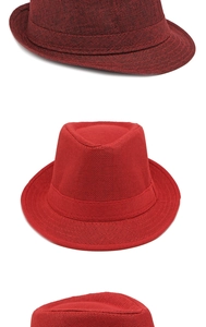 Detailed close-up of woven fedora hats in red and wine red with matching hatbands
