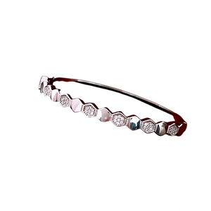 Minimalist silver hexagonal honeycomb bangle with sparkling cubic zirconia pavé setting