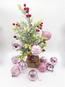 Detailed set of pink Christmas ornaments with various textures and small pine tree