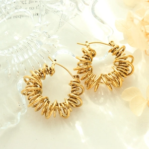 Unique geometric spiral hoop earrings in gold finish with a textured twisted design