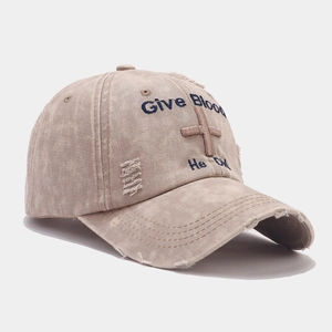 Distressed khaki baseball cap with cross embroidery and 'Give Blood' blue text