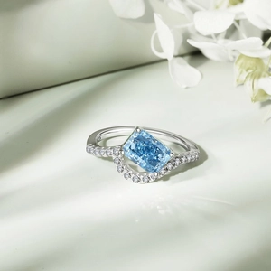 Macro shot of S925 silver ring featuring blue rectangle zircon and 925 engraving detail