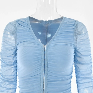 Close-up of blue mesh long sleeve dress with V-neckline and front hook-and-eye buttons