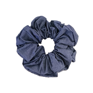 Deep blue denim scrunchie with embroidered rose design for elegant ponytail styling