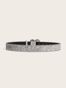 Detail of silver sequined wide belt with rhinestone heart buckle and beaded edges