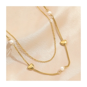 Double-layered gold titanium necklace with elegant white pearls and 3D heart pendants