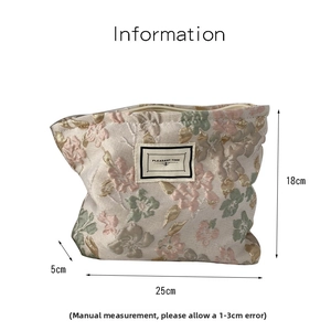 Detail view of floral jacquard pouch showing 25x18x5cm dimensions and textile texture