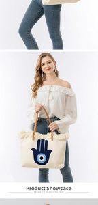 Bohemian woven tote bag with Hamsa Hand embroidery, tassel edges, and leather handles
