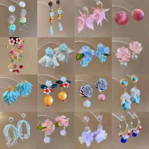 Colorful floral earrings set in various styles including acrylic and resin flower designs