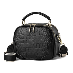 Classic black crocodile pattern handbag with dual zippers and wide woven shoulder strap
