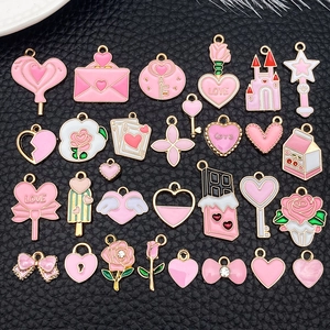 Pink and gold enamel heart, key, and rose pendants for DIY jewelry making sets
