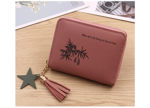 Pink faux leather coin purse featuring bamboo print, tassel charm, and green star pendant