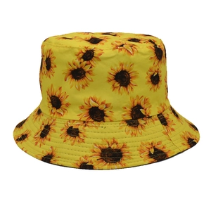 Detail view of sunflower pattern and reinforced stitching on yellow canvas bucket hat