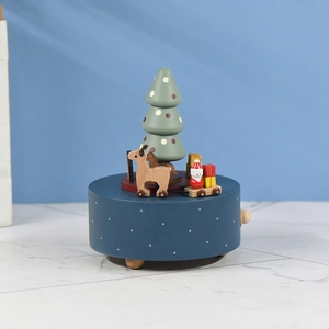 Rotating wooden Christmas music box with reindeer and Santa on a blue base