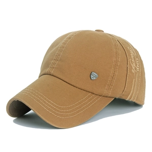Close-up of khaki cotton baseball cap with Freestyle embroidery and metal shield logo