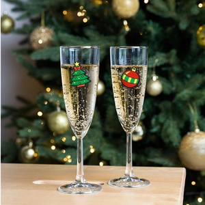 Close-up of PVC Christmas tree and ball charms used as wine glass markers for parties