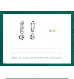 Detail of 925 sterling silver hoop earrings with 6mm cubic zirconia and S925 stamp