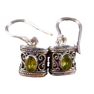 Vintage silver earrings with green oval gemstone and ethnic filigree patterns