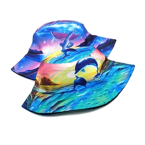 Detail of two bucket hats showing dolphin and flying fish digital print on fabric