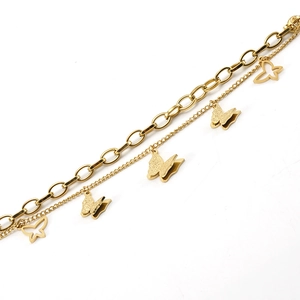 Close-up of golden double-layered chain bracelet with frosted and hollow butterfly charms