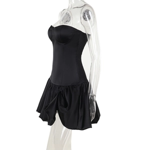 Detail view of black strapless mini dress with side pleats and cinched waist design