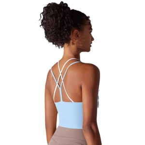 Light blue cross-back sports bra for women featuring a stylish double-strap design for yoga