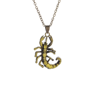 Vintage bronze scorpion pendant necklace for men with detailed metal texture on white background