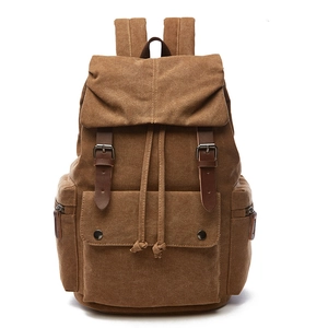 Classic coffee canvas backpack with leather straps and flap closure on white background