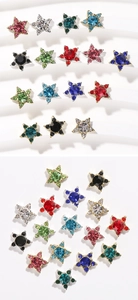 Close-up of colorful star-shaped rhinestone nail art charms in various vibrant colors