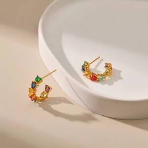 Luxurious 18K gold plated hoop earrings with colorful zircon gemstones on white plate