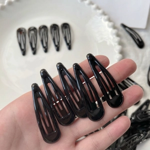 Classic black teardrop metal snap hair clips for women with a minimalist matte finish
