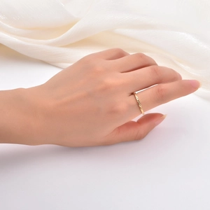 Detail shot of 18K gold plated titanium ring featuring a 1.5mm twisted diamond pattern