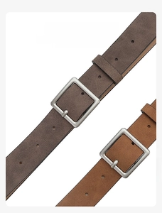 Detail view of brown and dark brown PU leather belts with square metal buckles on white background
