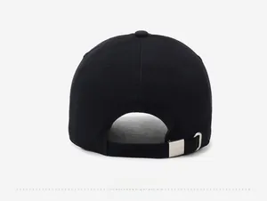 Detail view of the black cotton baseball cap showing adjustable silver buckle and stitching