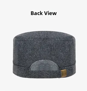 Back view of dark grey wool blend flat top cap with bronze buckle detail and thick texture