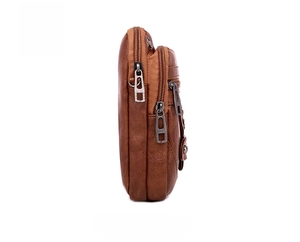 Side view of brown PU leather shoulder bag featuring functional three-zipper compartments