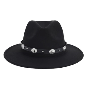 Close-up of black felt fedora hat featuring a vintage leather band with silver studs