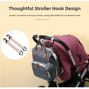 Detail view of grey diaper bag with stroller hooks and premium leather zipper pullers