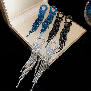 Three pairs of elegant tassel earrings with sparkling rhinestones in black, blue, and silver