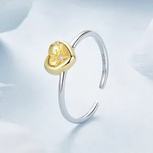 S925 sterling silver open ring featuring a gold starburst heart and sparkling zircon